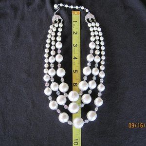 Vintage triple strand of white graduated round beads and smaller clear beads